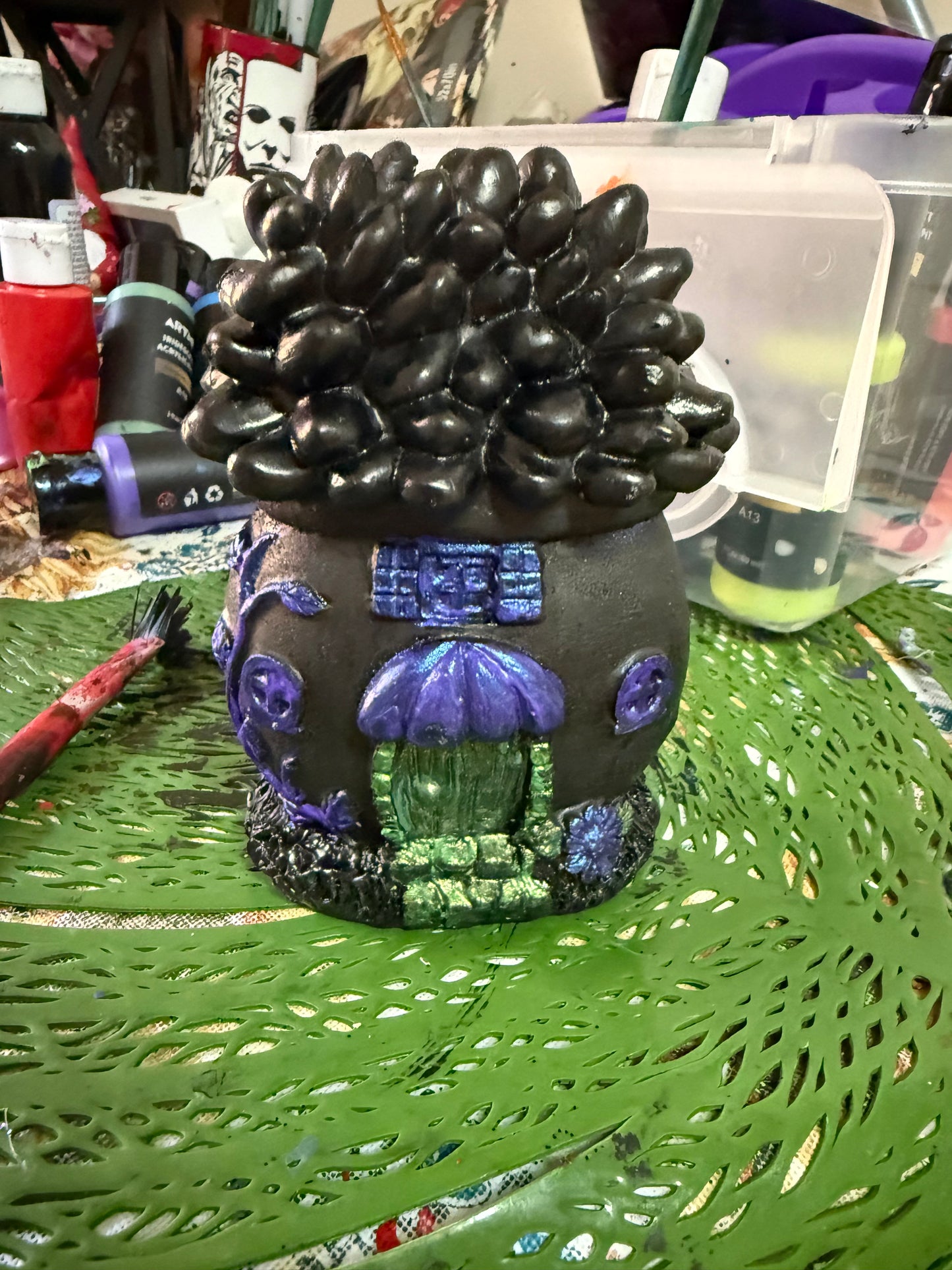 Goblin gnomes with a goth style fairy house