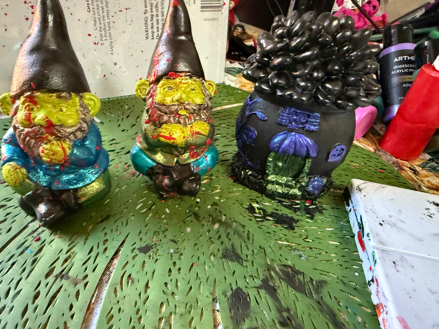 Goblin gnomes with a goth style fairy house